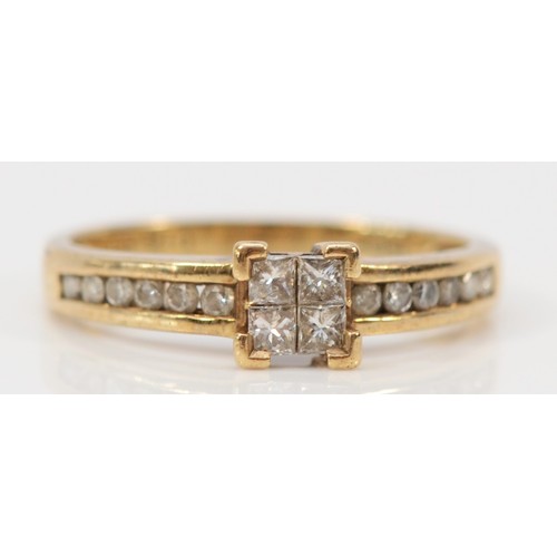 603 - A 9ct gold and diamond ring, four Princess cut diamonds flanked by brilliant cut diamond set shoulde... 