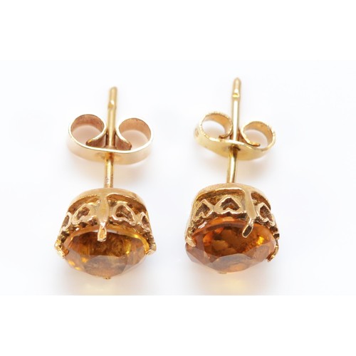 614 - A pair of 9ct gold citrine earrings with scroll backs, 7mm diameter, 1.7g