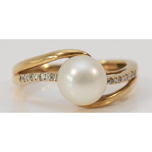 615 - A 9ct gold cultured pearl and diamond dress ring, L, 2.6g