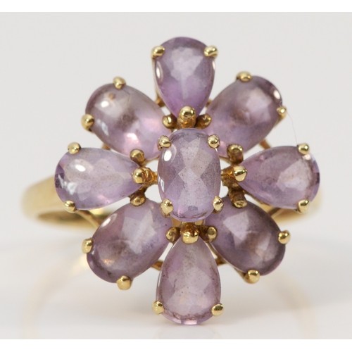 616 - A 9ct gold amethyst floral cocktail ring, 18mm ring front, O, 2.7g