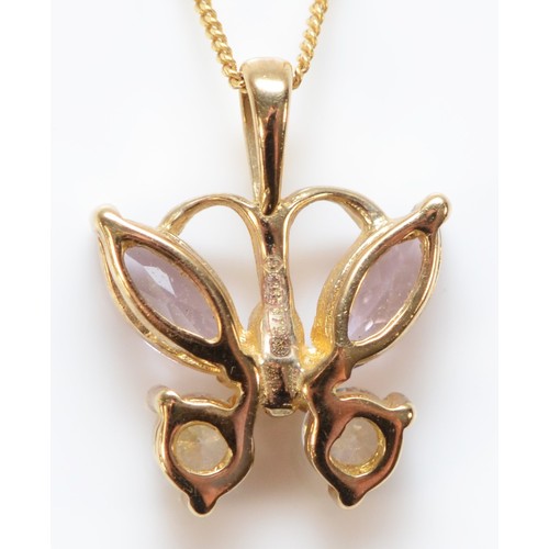 618 - A 9ct gold white gemstone and tanzanite butterfly pendant with chain, 11mm across, 1.8g