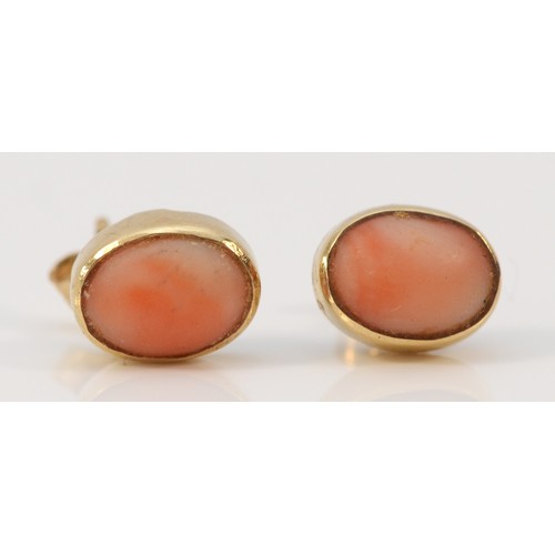 620 - A pair of 9ct gold coral earrings with scroll backs, 8mm, 1.8g