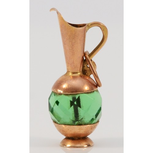 621 - A 9ct gold vintage emerald paste charm in the shape of a pitcher, 25mm total length, 2.2g