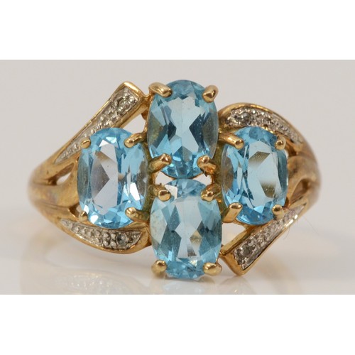 627 - A 9ct gold blue topaz and diamond dress ring, 15mm ring front, P 1/2, 3.5g