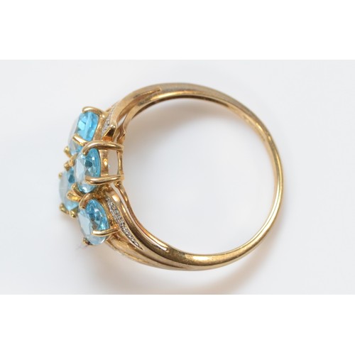 627 - A 9ct gold blue topaz and diamond dress ring, 15mm ring front, P 1/2, 3.5g