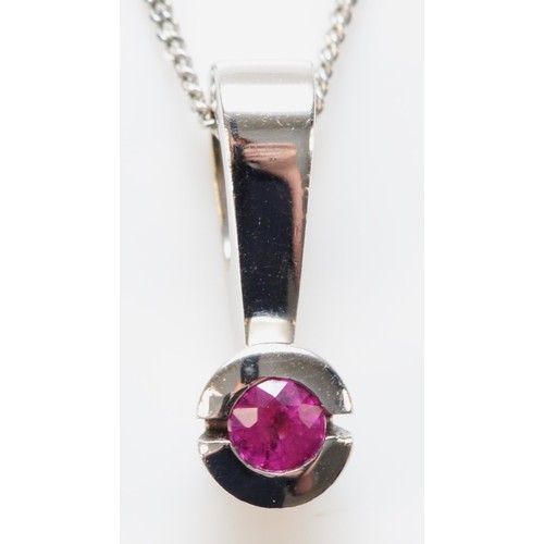 636 - A 9ct white gold ruby pendant with chain, 15mm pendant length, 2.6g