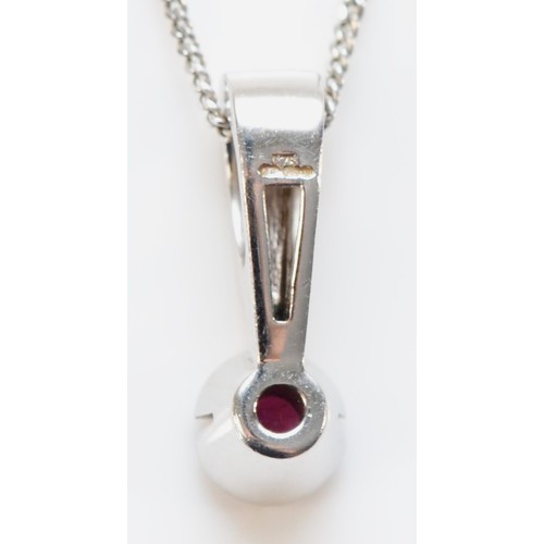 636 - A 9ct white gold ruby pendant with chain, 15mm pendant length, 2.6g