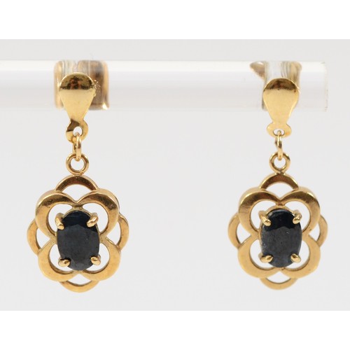 637 - A pair of 9ct gold oval cut sapphire drop earrings with scroll backs, 20mm drop, 1.5g