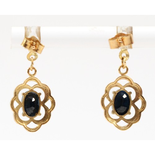 637 - A pair of 9ct gold oval cut sapphire drop earrings with scroll backs, 20mm drop, 1.5g