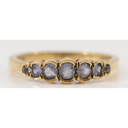 640 - A 9ct gold graduated tanzanite half eternity ring, O, 2.4g