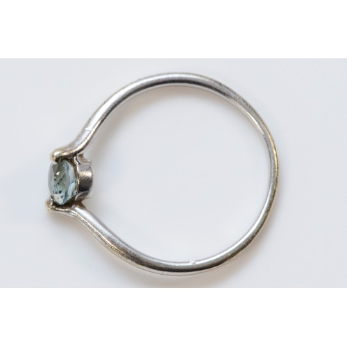 641 - A 9ct white gold blue topaz solitaire ring, O, 1.7g