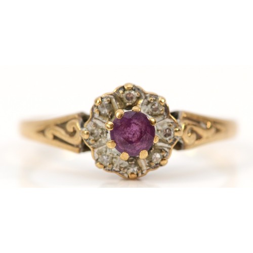 643 - A 9ct gold ruby and diamond cluster ring, K, 1.3g