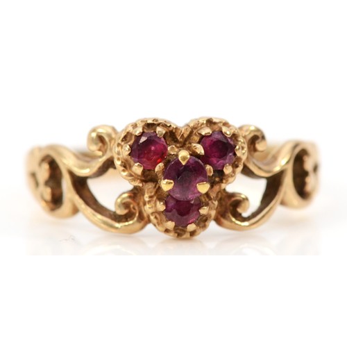 649 - A 9ct gold vintage three stone ruby ring with patterned shoulders, L 1/2, 2.2g