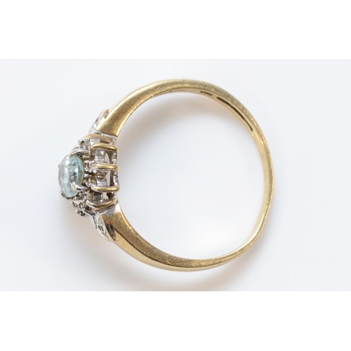 652 - A 9ct gold aquamarine and diamond cluster ring, K, 1.8g