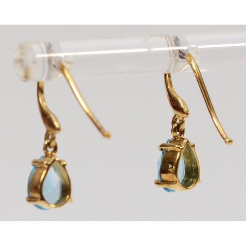 655 - A pair of 9ct gold pear cut blue topaz drop earrings with hooks, 6mm topaz length, 1.4g