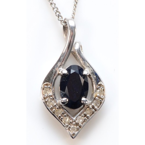 656 - A 9ct white gold sapphire and diamond pendant with chain, 15mm pendant length, 1.6g