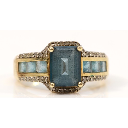 657 - A 9ct gold blue topaz and diamond dress ring, 9mm x 6mm topaz, P, 4.5g