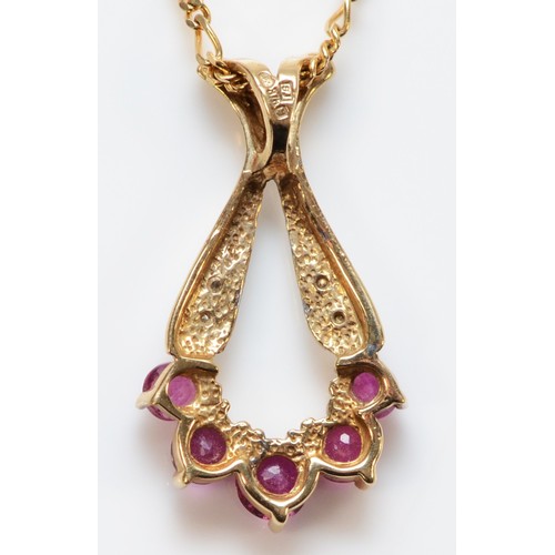 662 - A 9ct gold ruby and diamond pendant, 20mm pendant length, 2.7g