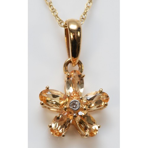 663 - A 9ct gold yellow topaz and diamond floral pendant, 11mm pendant, 1.9g