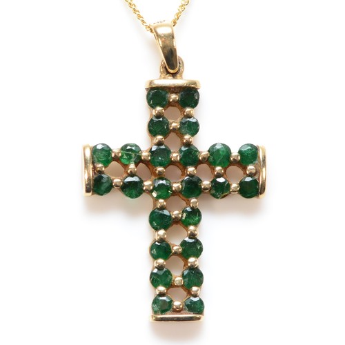 664 - A 9ct gold green gemstone cross pendant with chain, 20mm cross length, 2.5g