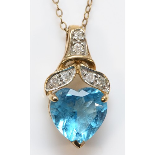 666 - A 9ct gold heart cut blue topaz and diamond pendant, 20mm total pendant length, 3.2g