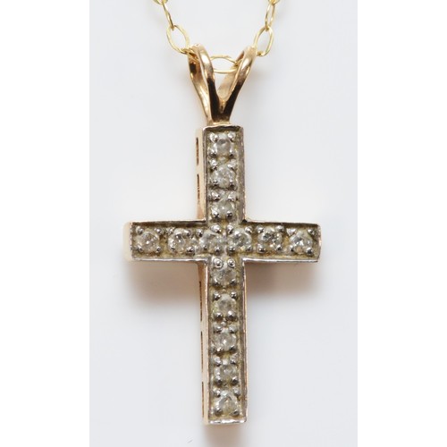 667 - A 9ct gold brilliant cut diamond cross pendant with chain, 17mm cross length, 1.2g