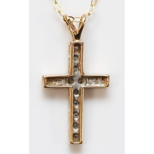 667 - A 9ct gold brilliant cut diamond cross pendant with chain, 17mm cross length, 1.2g