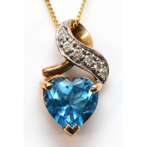 668 - A 9ct gold heart shaped blue topaz and diamond pendant with chain, 15mm total pendant length, 2.6g