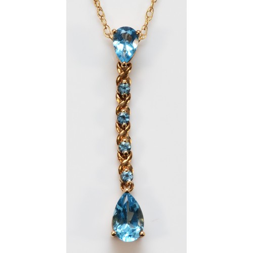 669 - A 9ct gold pear cut blue topaz drop pendant with chain, 33mm total pendant drop, 2.3g