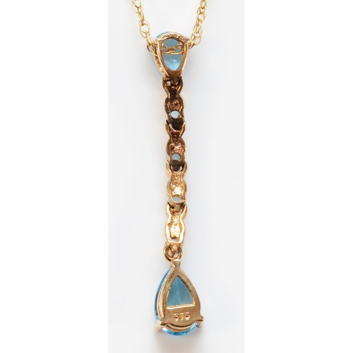 669 - A 9ct gold pear cut blue topaz drop pendant with chain, 33mm total pendant drop, 2.3g