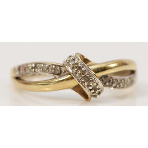 672 - A 9ct gold and diamond twist ring, N, 1.8g