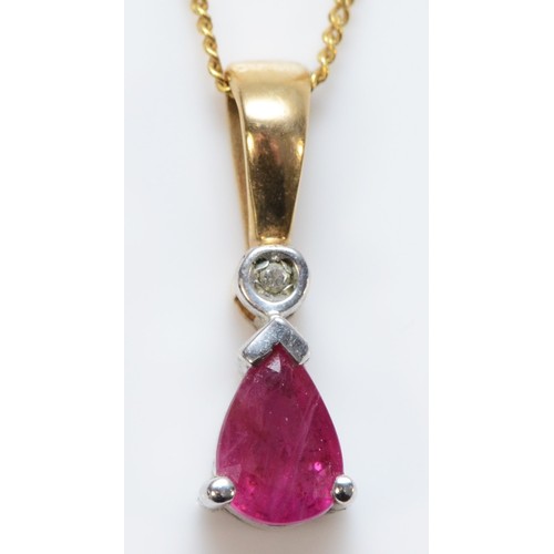 674 - A 9ct gold ruby and diamond pendant with chain, 15mm total pendant length, 1.4g