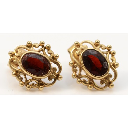 675 - A pair of 9ct gold garnet earrings with scroll backs, 13mm, 1.8g