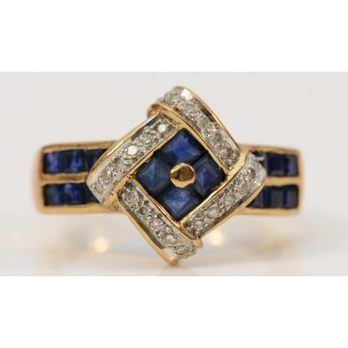 692 - A 9ct gold sapphire and diamond dress ring with sapphire set shoulders, O 1/2, 3.5g