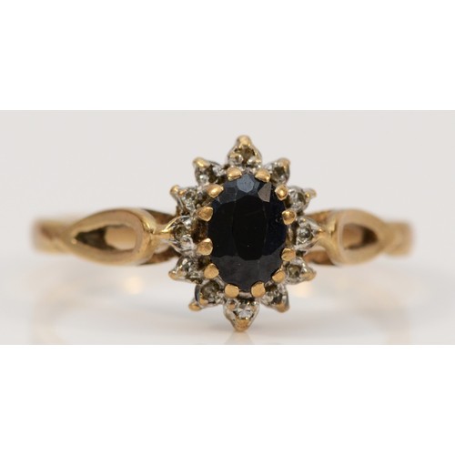 694 - A 9ct gold vintage sapphire and diamond cluster ring, London 1988, Q, 2.2g