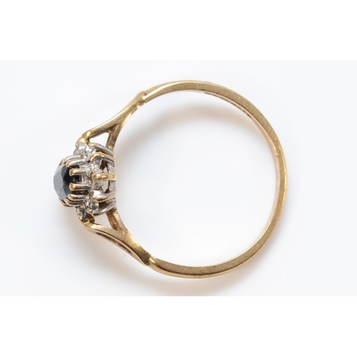 694 - A 9ct gold vintage sapphire and diamond cluster ring, London 1988, Q, 2.2g