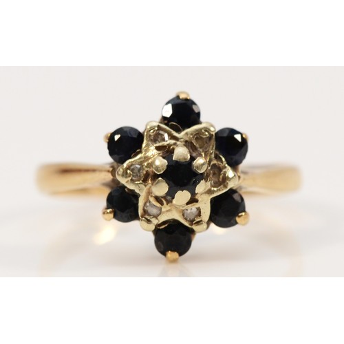 696 - A 9ct gold vintage sapphire and diamond cluster ring, P 1/2, 2.8g