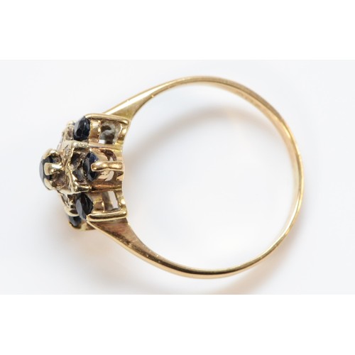 696 - A 9ct gold vintage sapphire and diamond cluster ring, P 1/2, 2.8g