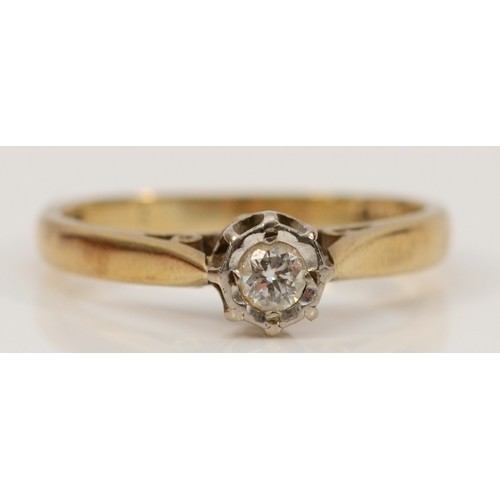 697 - A 9ct gold illusion set diamond single stone ring, London 1986, I 1/2, 1.7g