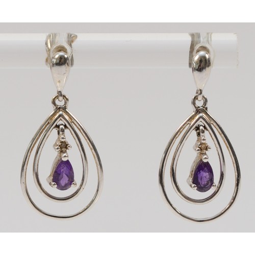 705 - A pair of 9ct white gold pear cut amethyst and diamond drop earrings with scroll backs, 23mm drop, 1... 