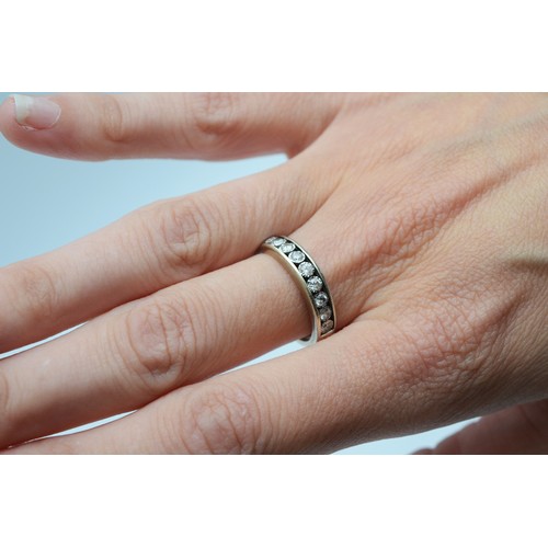 119 - A 9ct white gold brilliant cut diamond half eternity ring, M, 3.5g