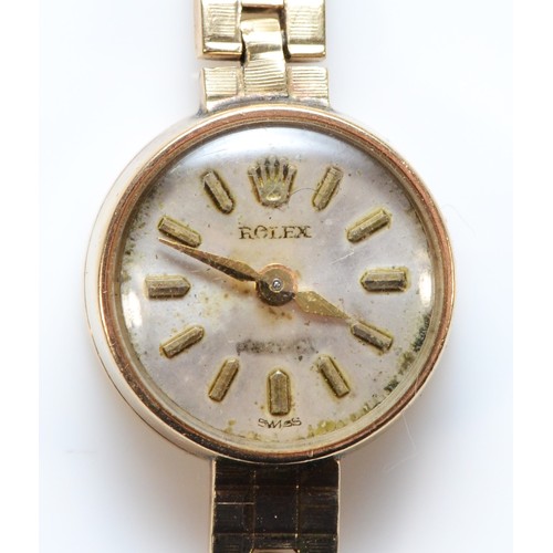 Rolex, a 9ct gold ladies manual wind wristwatch, Birmingham 1989, 18 jewel cal. 1401 movement, integral bracelet, Rolex motif, 13gm without movement.
No crown, balance spins, bracelet worn