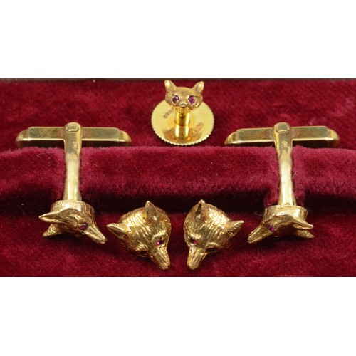 131 - Garrard & Co., a 9ct gold fox head pair of cufflinks, London 1978, ruby set eyes, together with a co... 