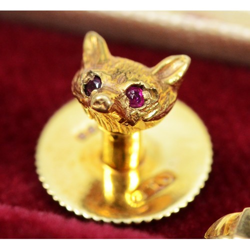 131 - Garrard & Co., a 9ct gold fox head pair of cufflinks, London 1978, ruby set eyes, together with a co... 