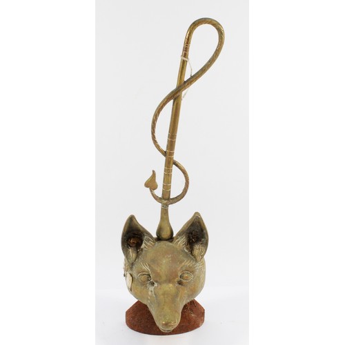 137 - A brass doorstop depicting a fox head and whip, on a stone base, H-44cm.