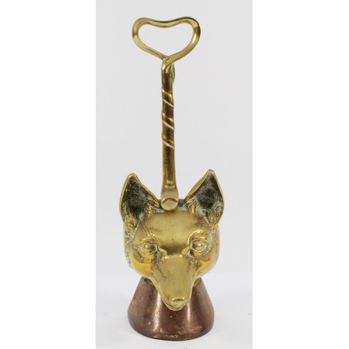 140 - A brass doorstop depicting a fox head and whip on a cast-iron base, H-36cm.