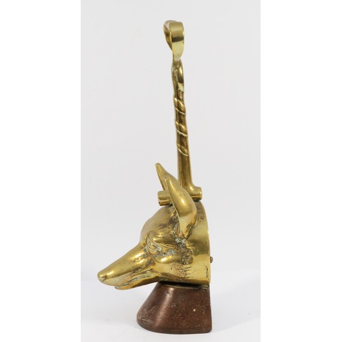 140 - A brass doorstop depicting a fox head and whip on a cast-iron base, H-36cm.