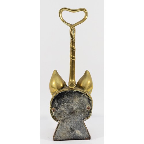 140 - A brass doorstop depicting a fox head and whip on a cast-iron base, H-36cm.