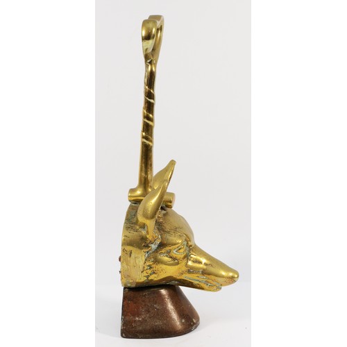 140 - A brass doorstop depicting a fox head and whip on a cast-iron base, H-36cm.