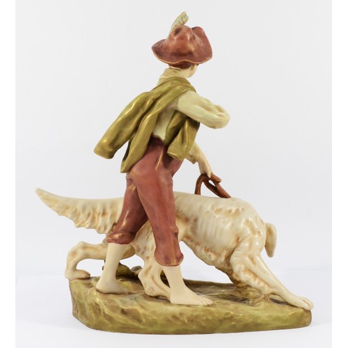 143 - A Royal Dux Bohemia ceramic figurine, depicting a young boy with a hunting dog, 34 x 23cm.